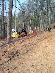 Grading equipment on a wooded site